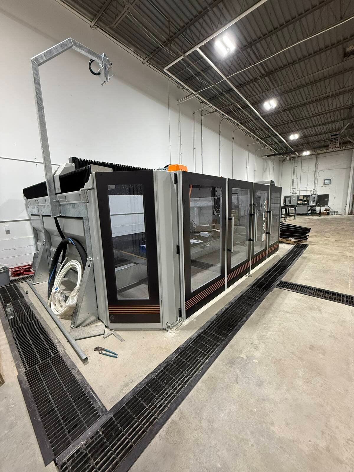 Large CNC bridge saw inside the QGS fabrication shop
