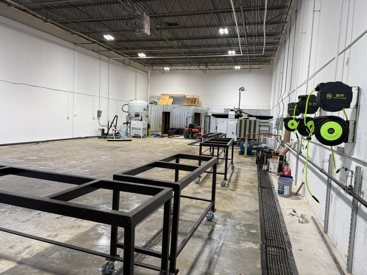 Fabrication bay with cutting tables at QGS
