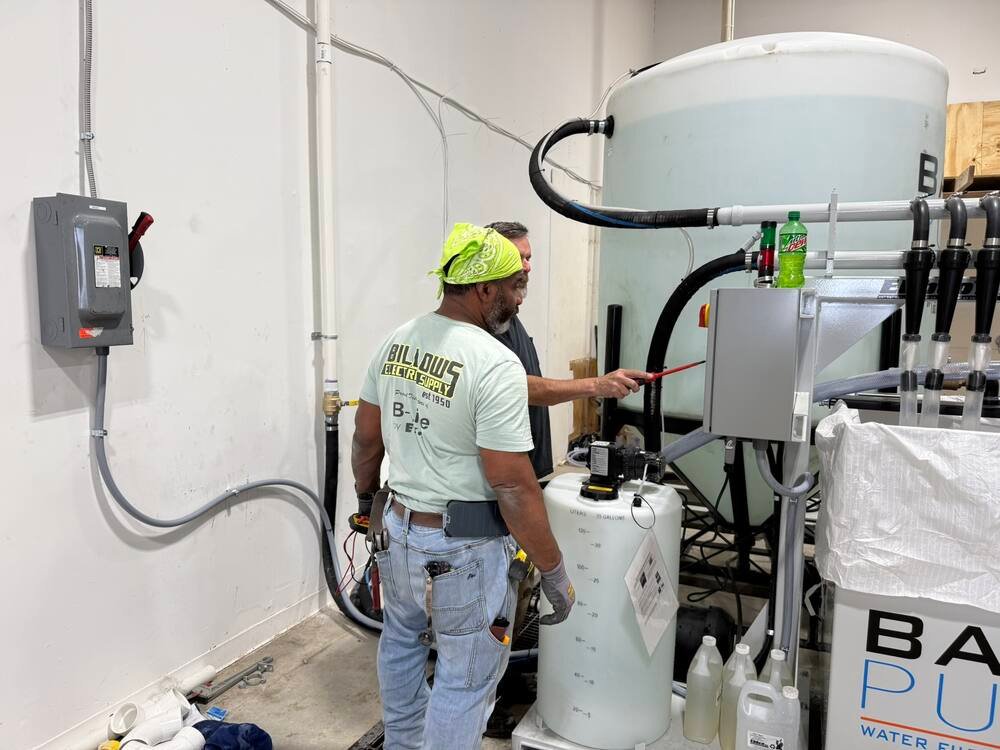 QGS crew member during equipment installation